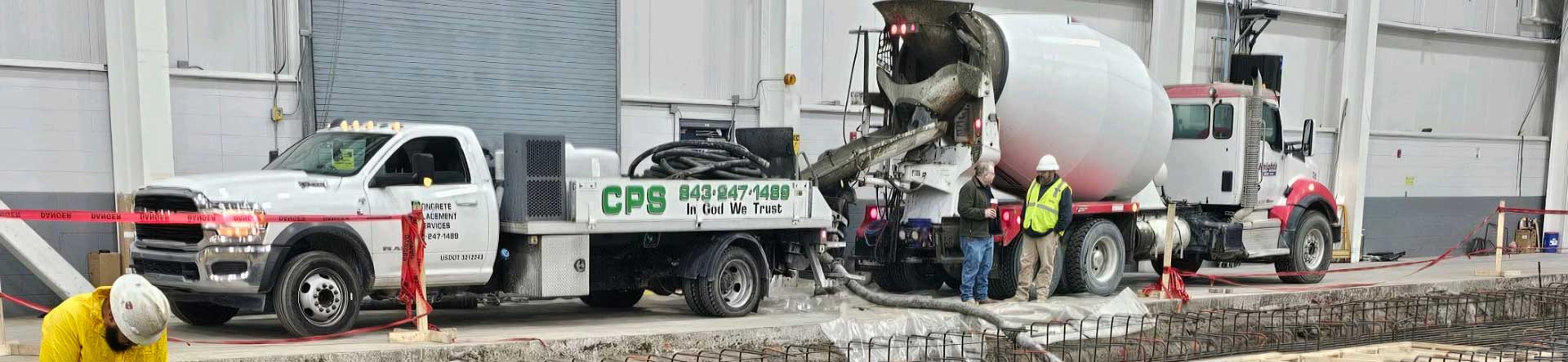Concrete Placement Services pumping concrete on a job site.