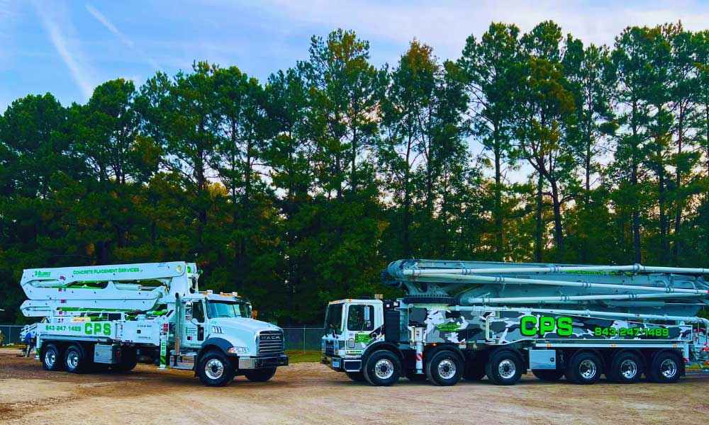 homepage-third-image-concrete-pour Image of two trucks, featuring Concrete Replacement Services and highlighting the reliable equipment used for professional concrete work.
